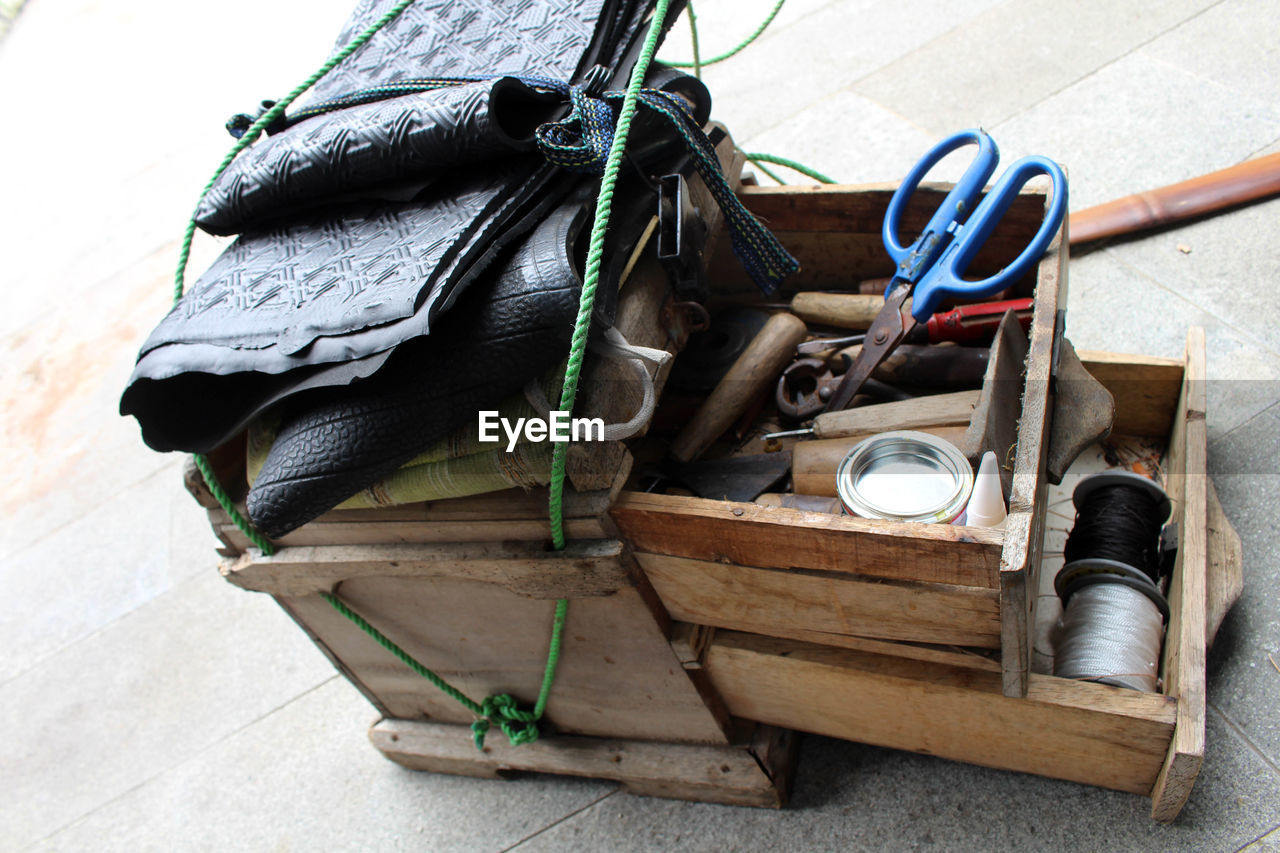 HIGH ANGLE VIEW OF SHOES ON BARBECUE GRILL