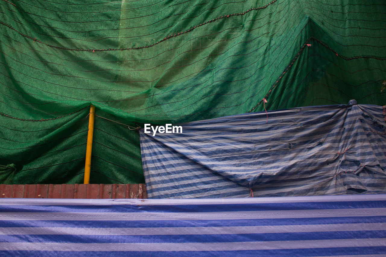 SCENIC VIEW OF TENT COVERED WITH TREE