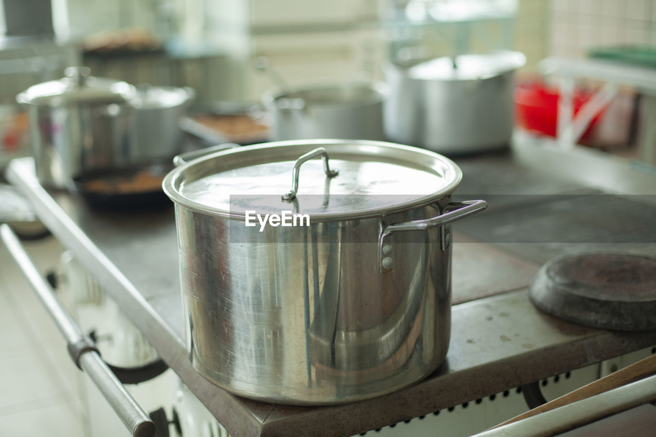 Large pot for cooking. kitchen utensils in the dining room. stainless steel water tank. 