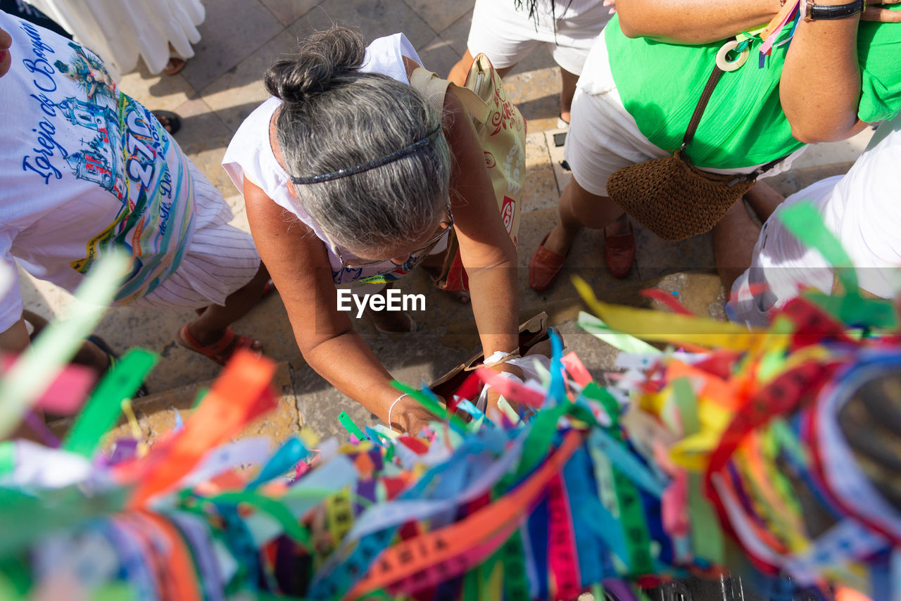 multi colored, adult, market, women, selective focus, retail, business, group of people, men, small business, festival, business finance and industry, working, selling, occupation, day, market stall, tradition, celebration, clothing, outdoors, person