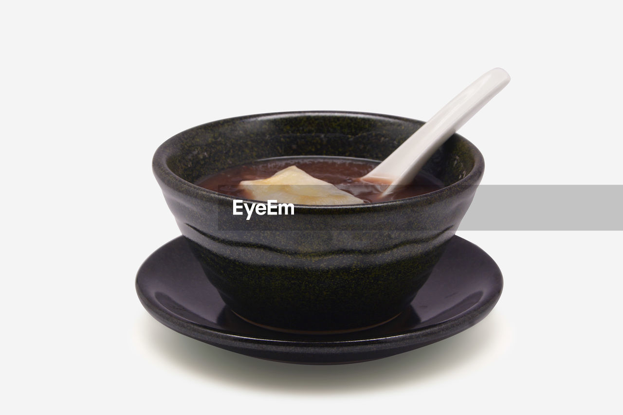 CLOSE-UP OF BLACK COFFEE IN BOWL