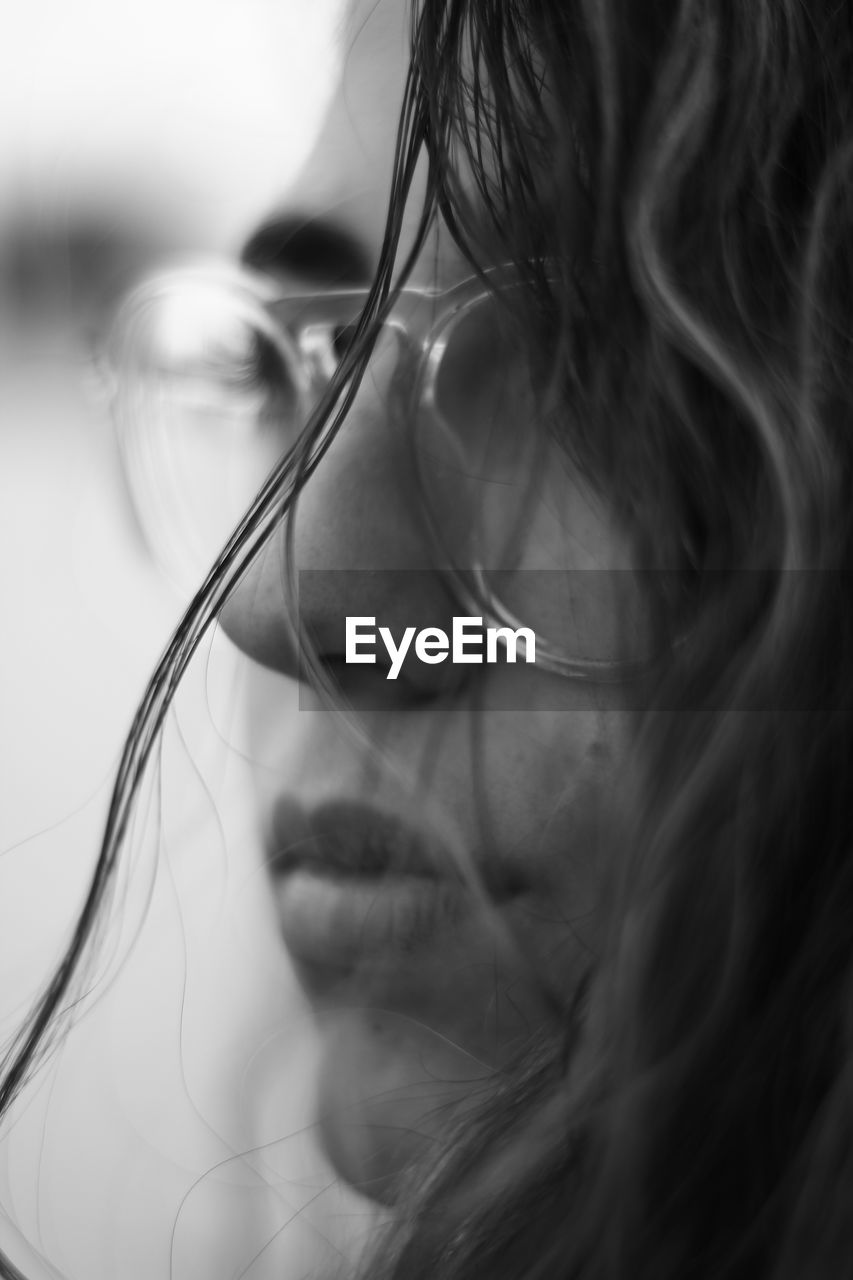 Close-up of thoughtful woman wearing eyeglasses