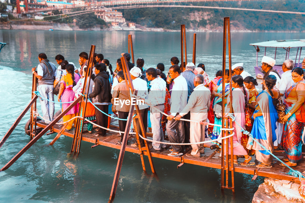 GROUP OF PEOPLE ON BOAT IN THE WATER