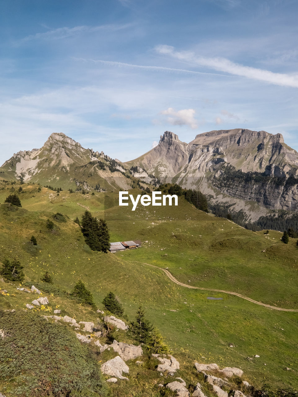 Countryside landscape against mountain range