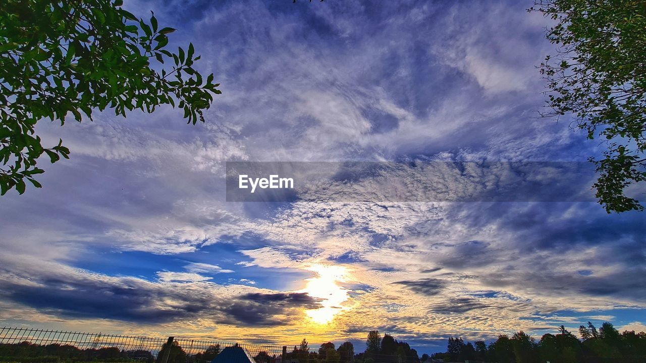 sky, cloud, tree, plant, beauty in nature, environment, landscape, nature, scenics - nature, sunlight, morning, tranquility, land, dusk, mountain, horizon, no people, dramatic sky, blue, tranquil scene, outdoors, cloudscape, travel destinations, non-urban scene, sun, travel, idyllic, rural scene, sunrise, tourism