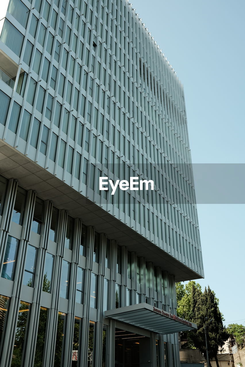 architecture, built structure, building exterior, city, skyscraper, building, office building exterior, office, low angle view, sky, facade, tower block, no people, nature, day, business, glass, outdoors, clear sky, residential district, reflection