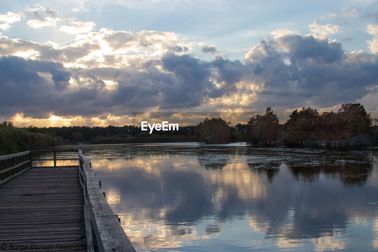 Scenic view of lake against sky during sunset