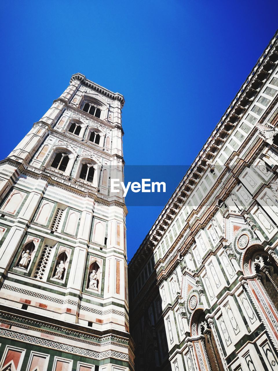 Low angle view of building against blue sky