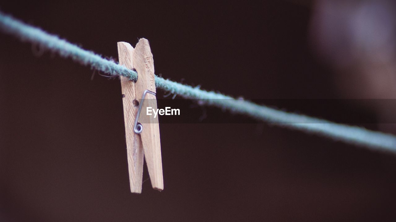 Close-up of clothespin on rope