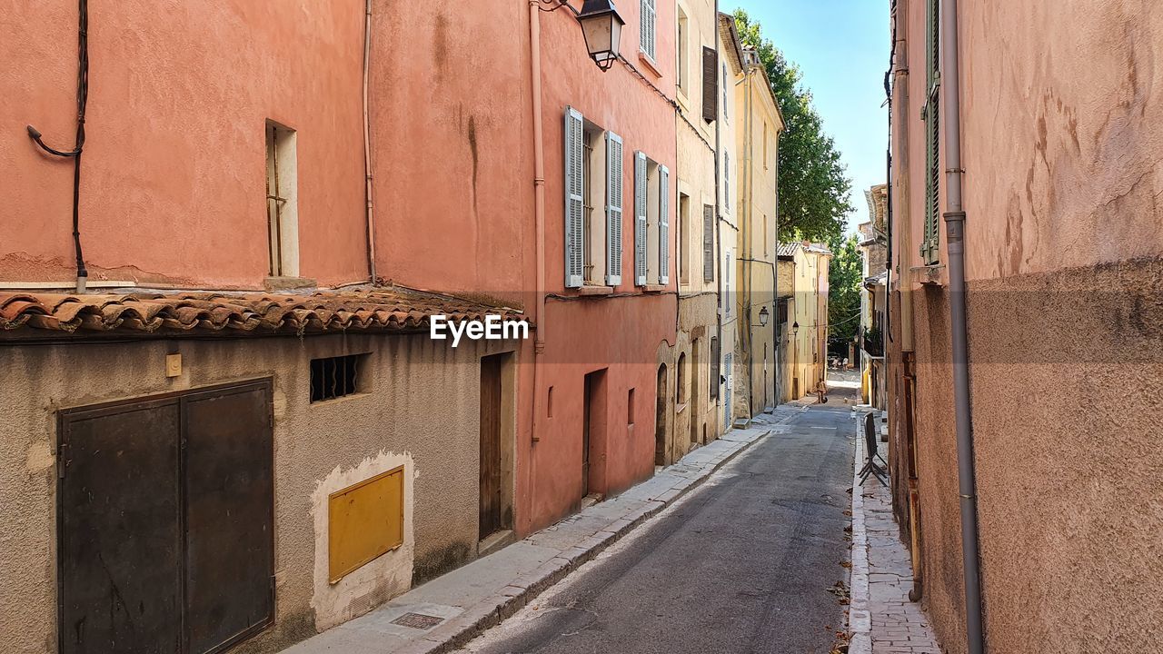 STREET AMIDST RESIDENTIAL BUILDINGS