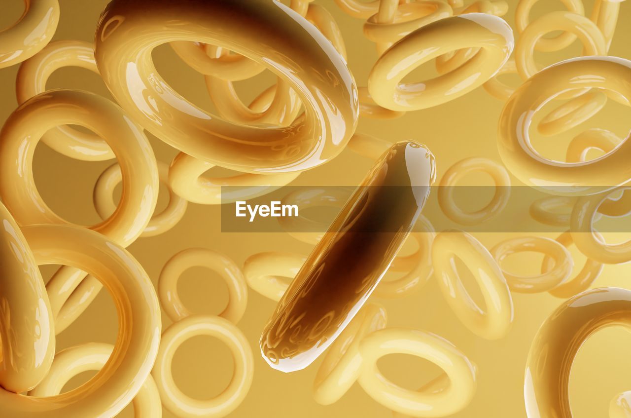 circle, yellow, no people, food, font, backgrounds, food and drink, indoors, pasta, italian food, pattern, gold