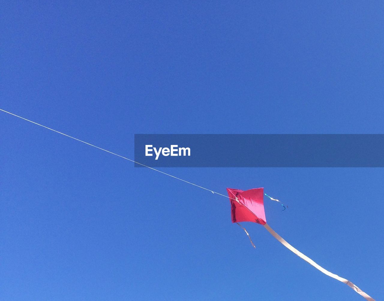 LOW ANGLE VIEW OF FLAG AGAINST CLEAR SKY