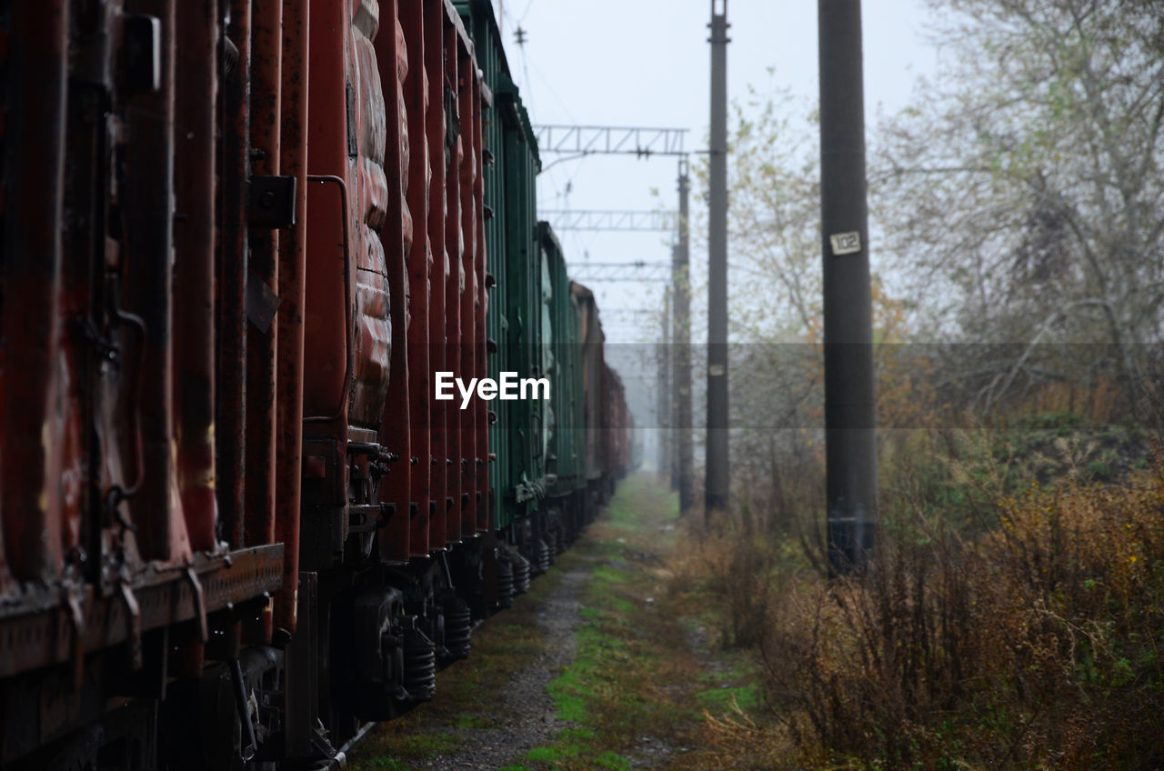 Train on railroad track in foggy weather