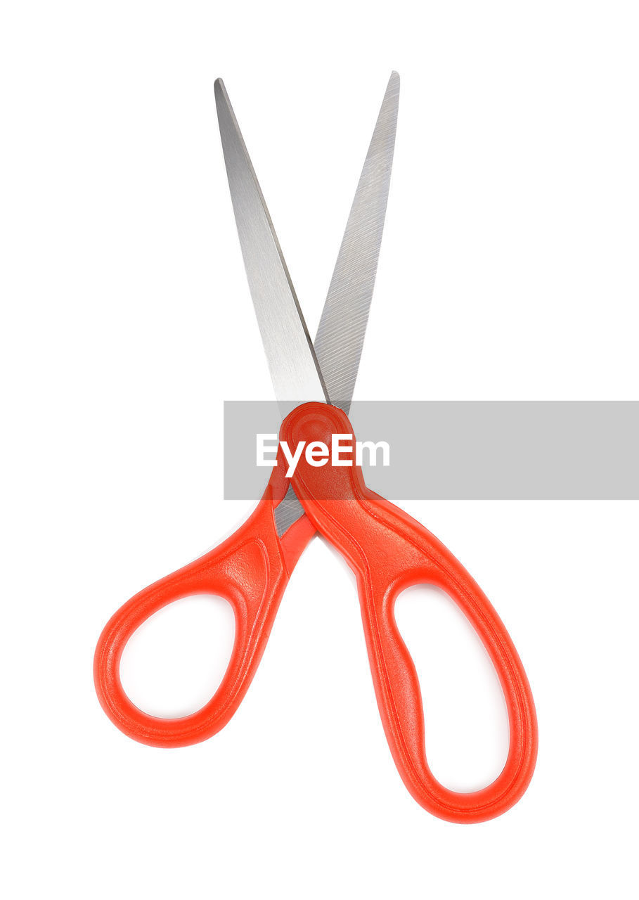 Close-up of scissor against white background