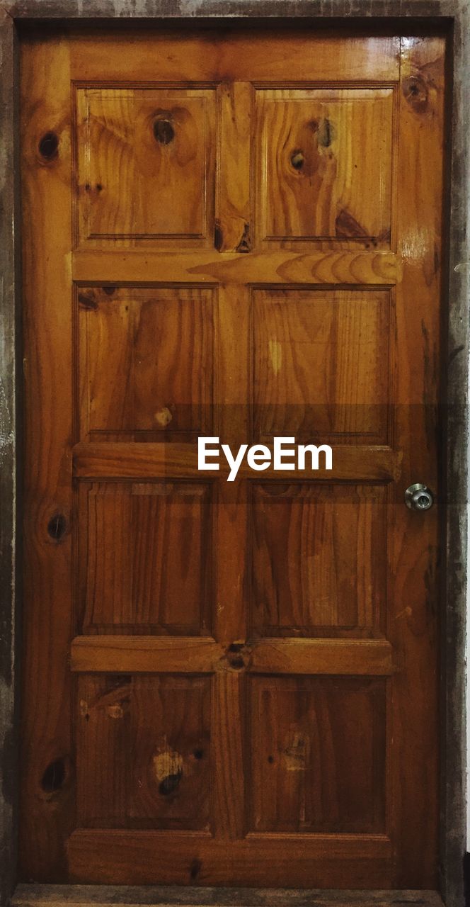 CLOSED WOODEN DOOR