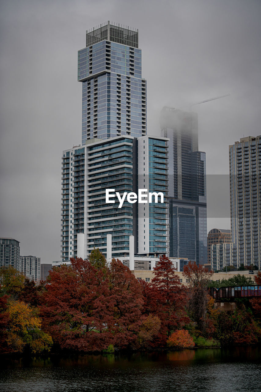 Modern buildings in city against sky