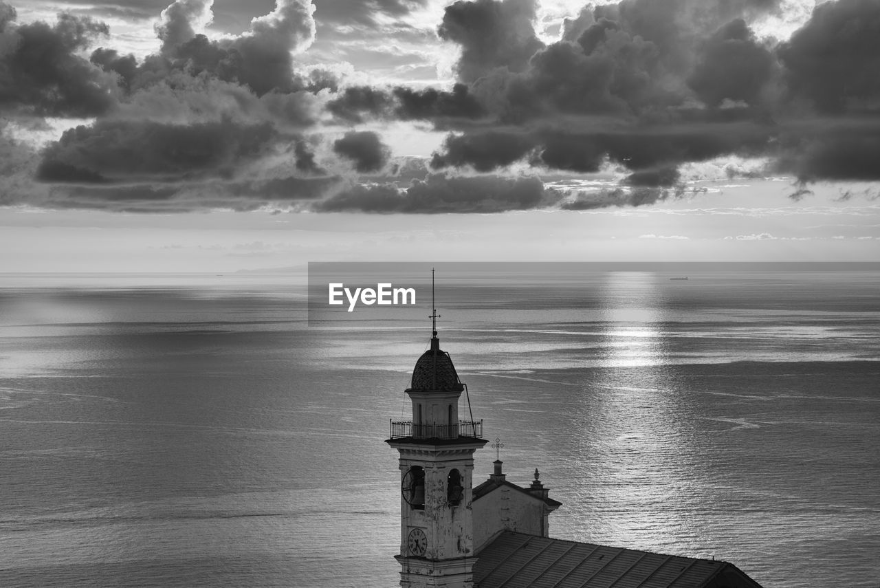 View of sea against cloudy sky, liguria, italy