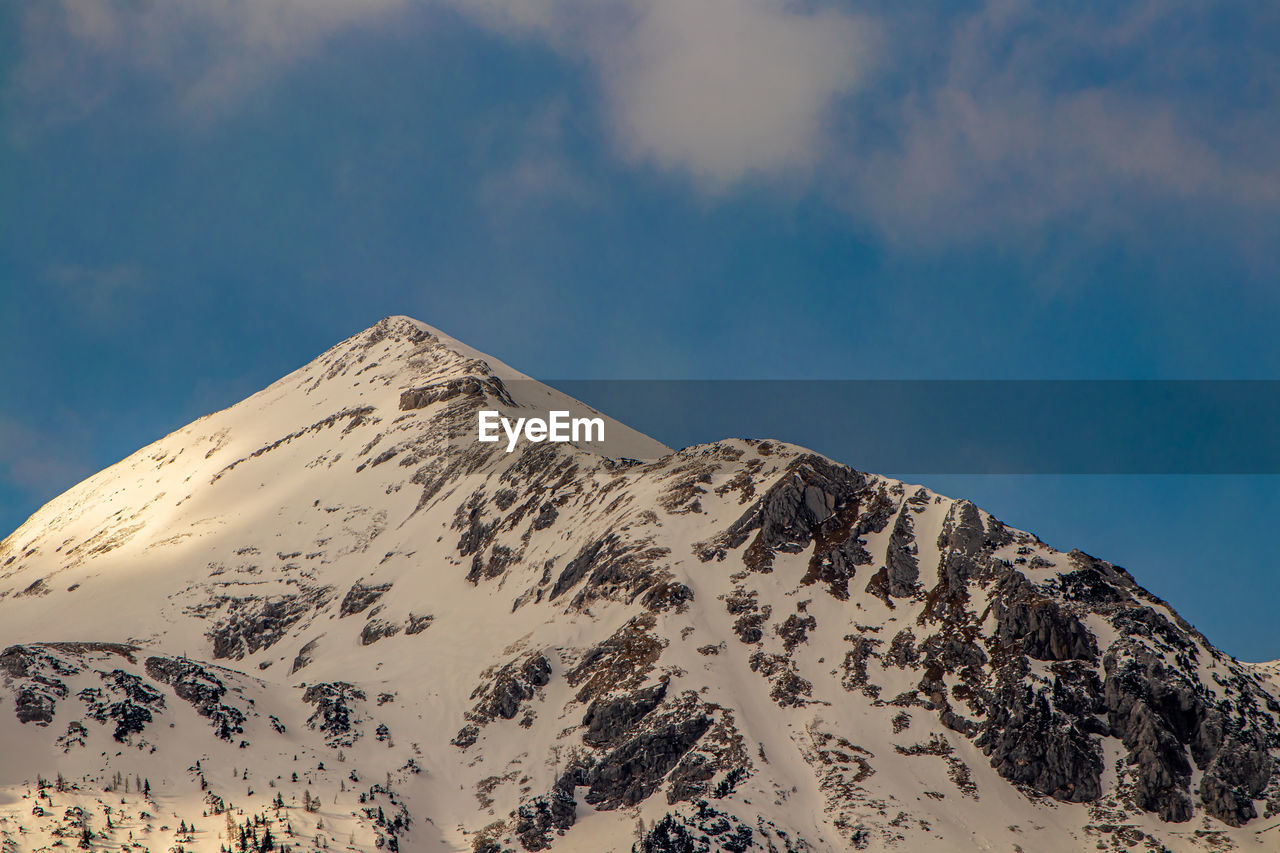 Scenic view of snowcapped mountain against sky