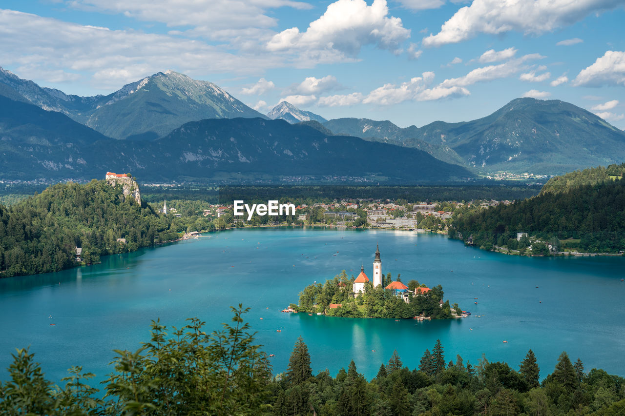 Scenic view of lake and mountains against sky