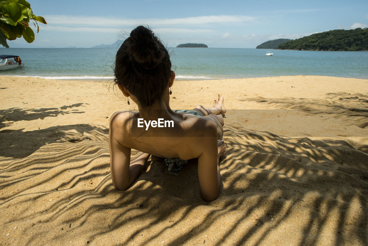 Girl lies on the brazilian beach