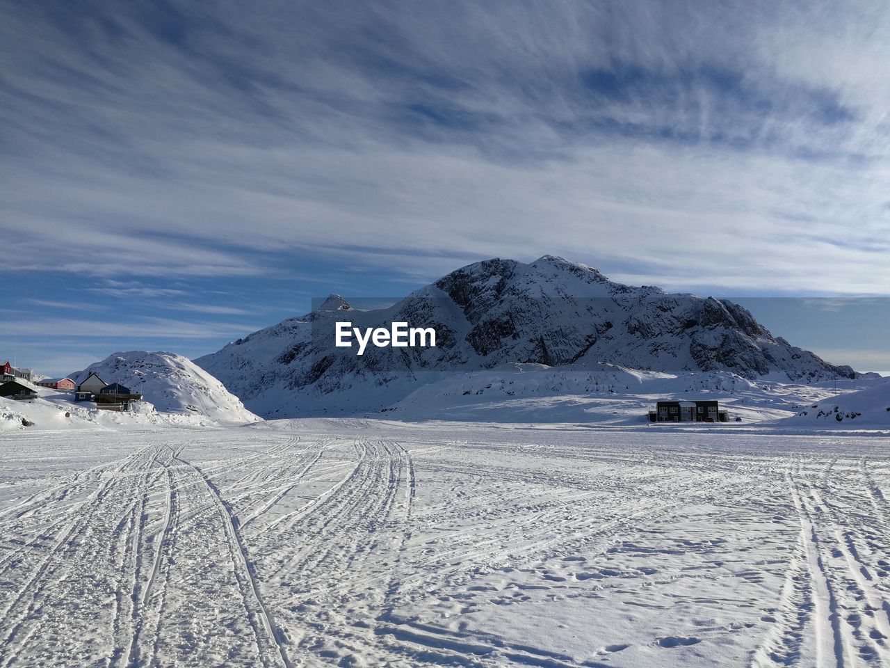 Scenic view of snow covered mountains against sky