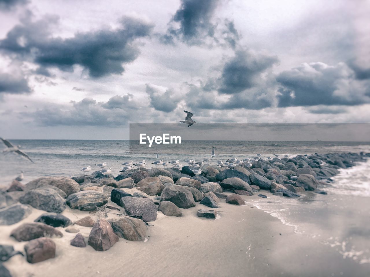 SCENIC VIEW OF SEA AND ROCKS AGAINST SKY