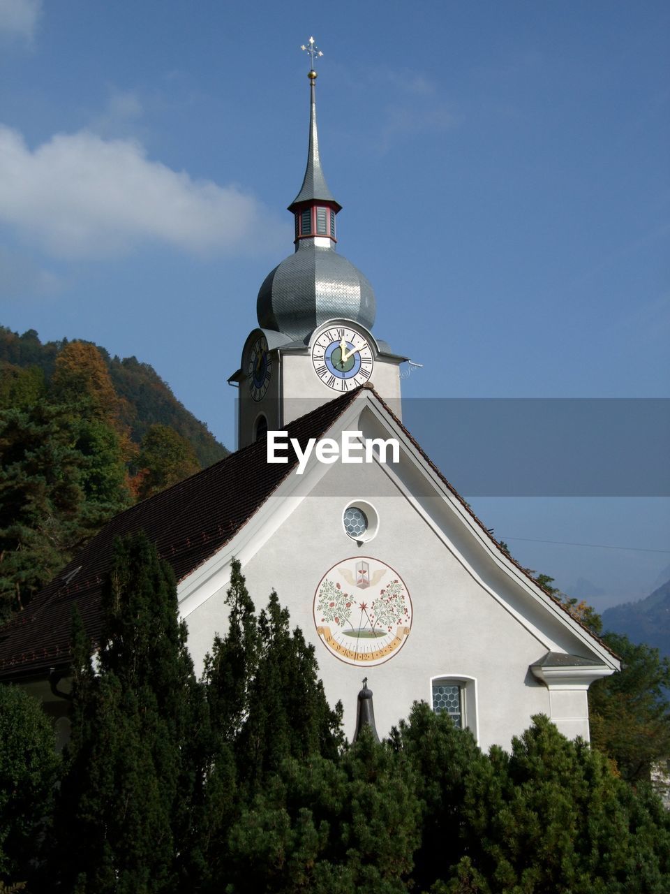 Low angle view of clock tower against sky