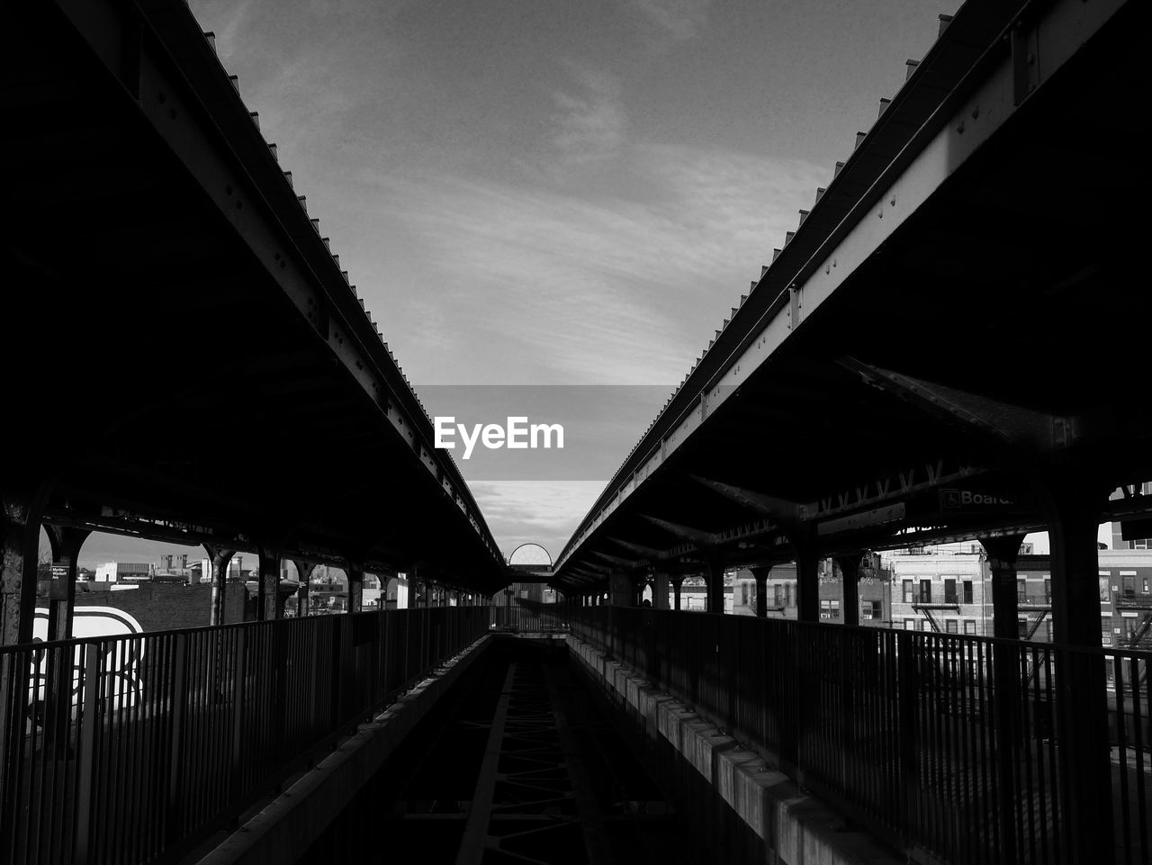 VIEW OF RAILROAD BRIDGE AGAINST SKY