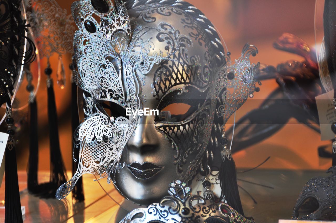 Close-up of masks for sale in store