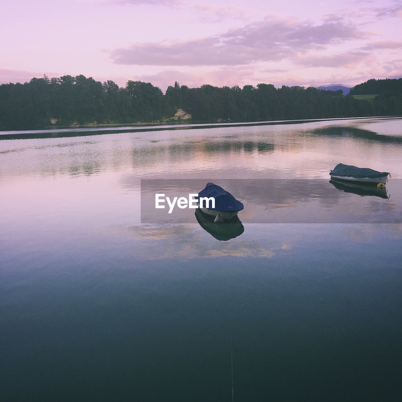 View of boats in lake against the sky