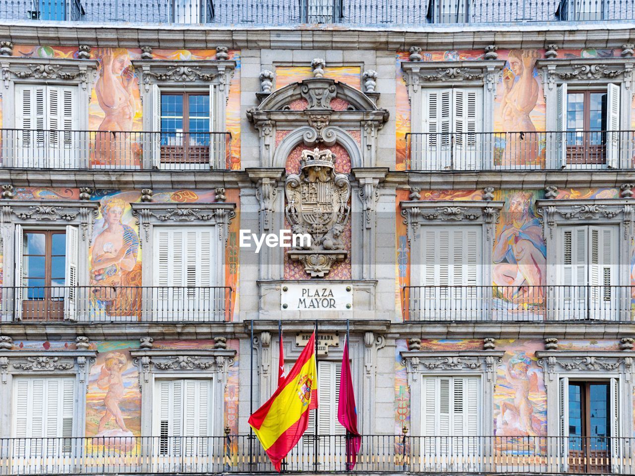 Spanish flag against plaza mayor