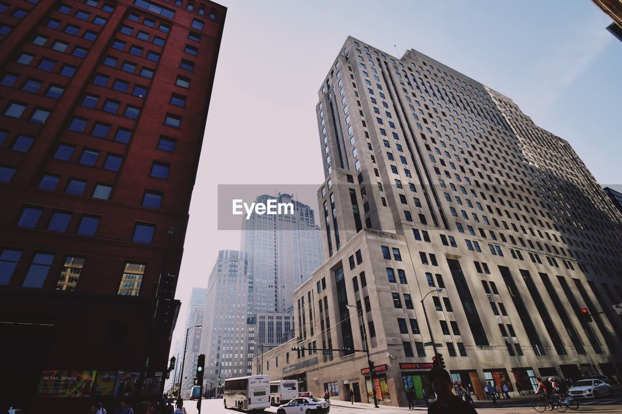 LOW ANGLE VIEW OF MODERN BUILDINGS AGAINST SKY