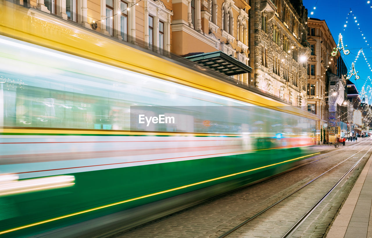 Blurred motion of train at railroad station