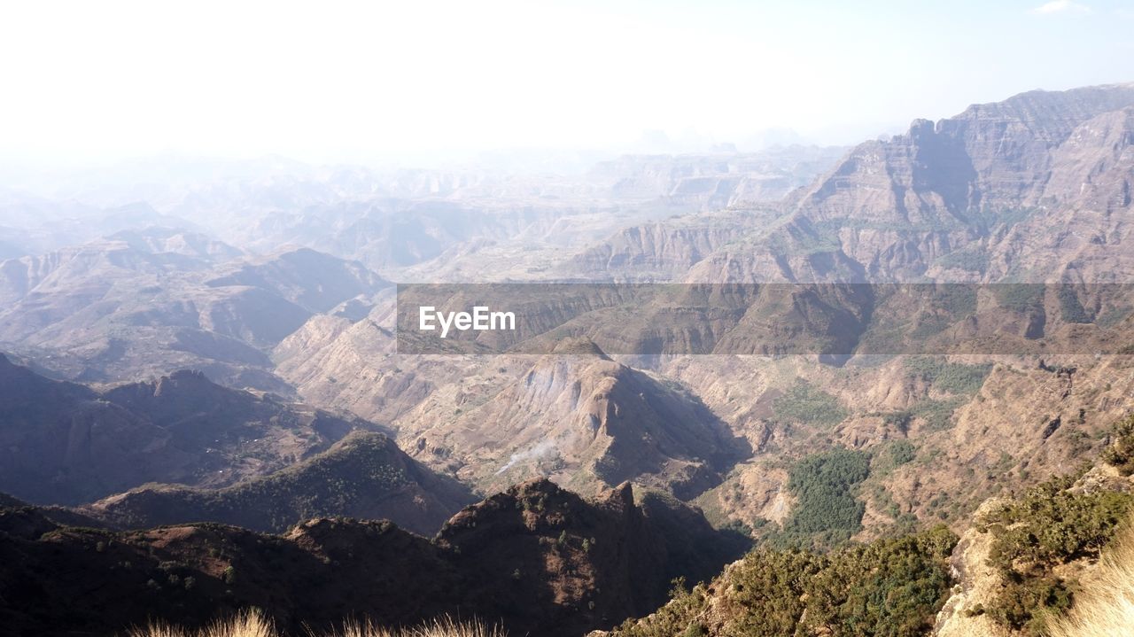 Aerial view of landscape and mountains against sky