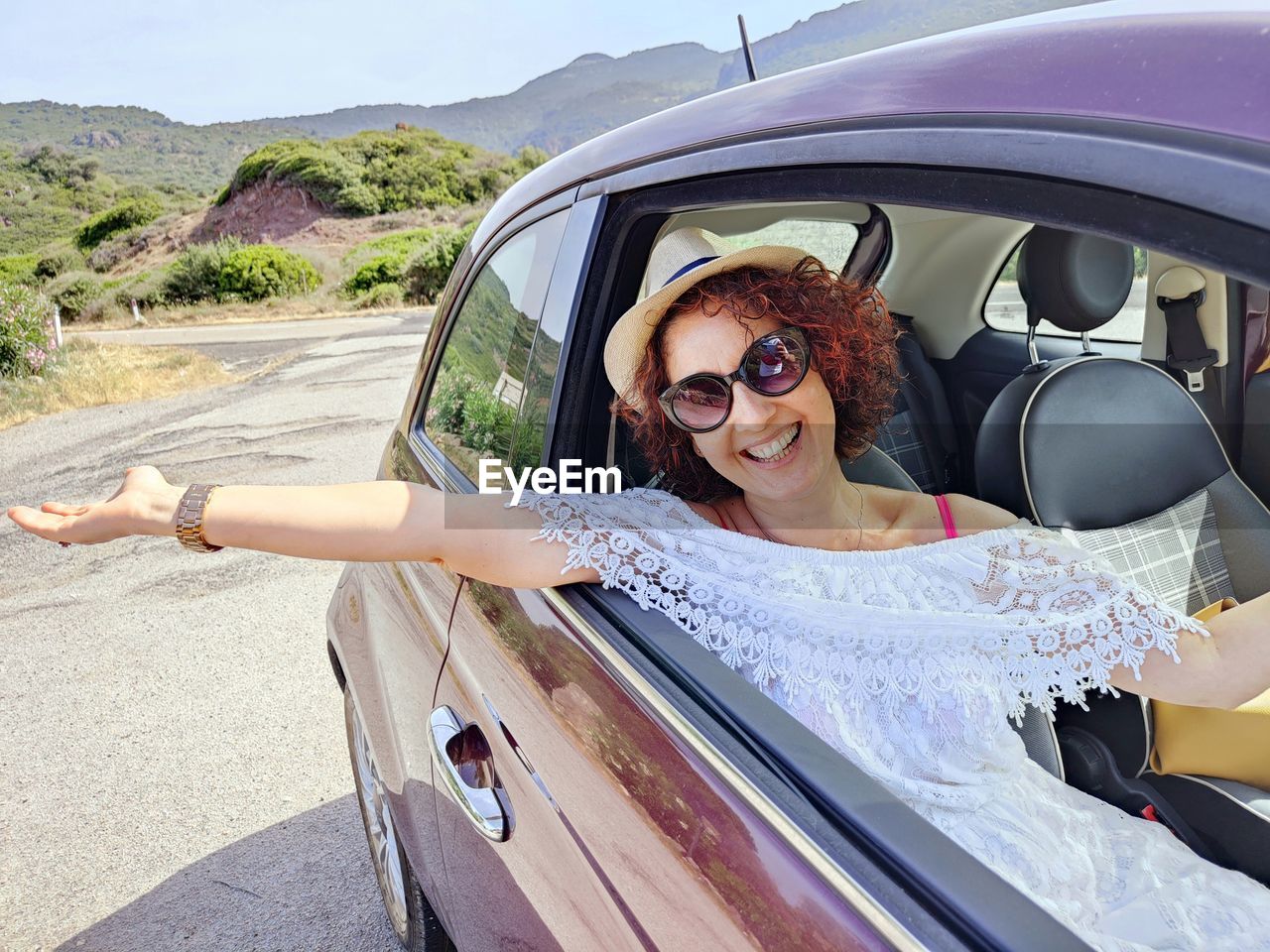 Portrait of young woman in car