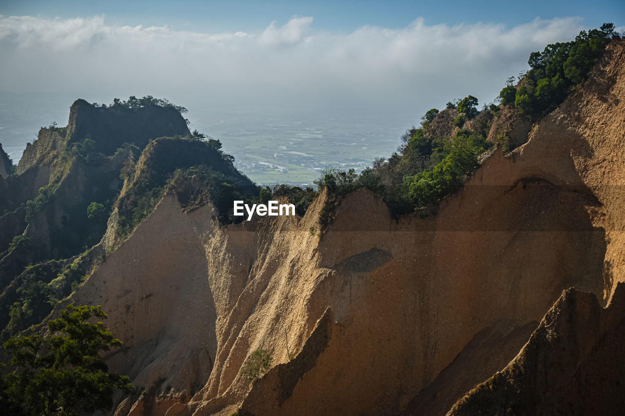 Panoramic view of rock formations against sky