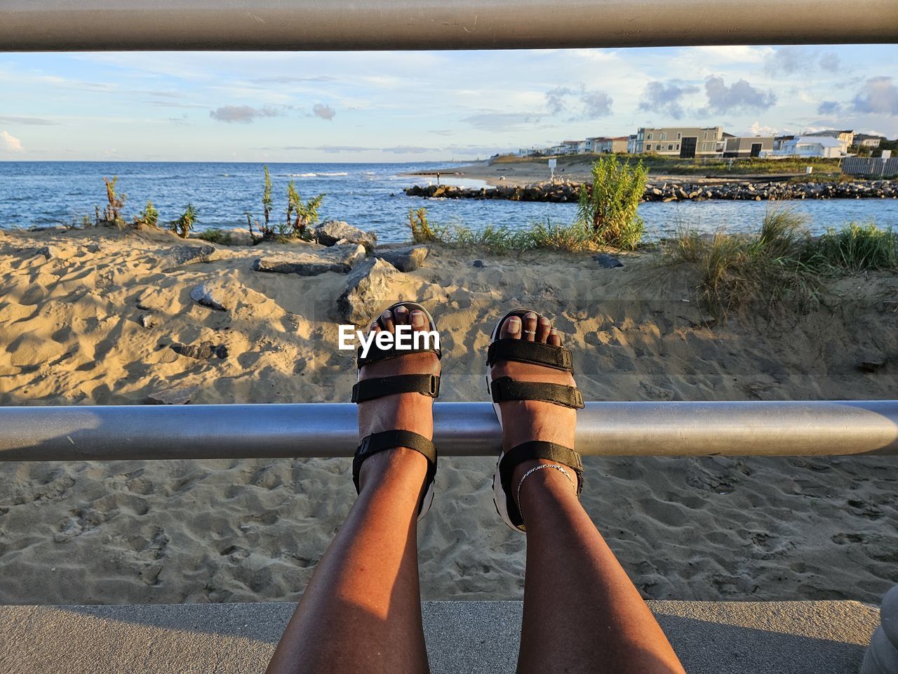 water, beach, sea, human leg, nature, low section, personal perspective, shore, land, vacation, one person, leisure activity, coast, sky, shoe, day, lifestyles, sand, adult, limb, women, human limb, ocean, relaxation, beauty in nature, outdoors, cloud, horizon over water, sunlight, horizon, holiday, blue, trip, scenics - nature, human foot, sandal, rock, sitting