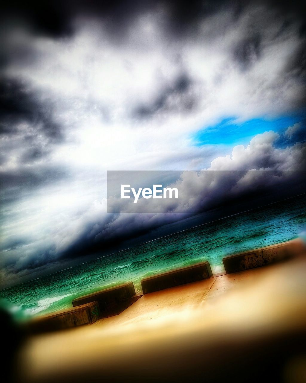 VIEW OF SEA AGAINST CLOUDY SKY