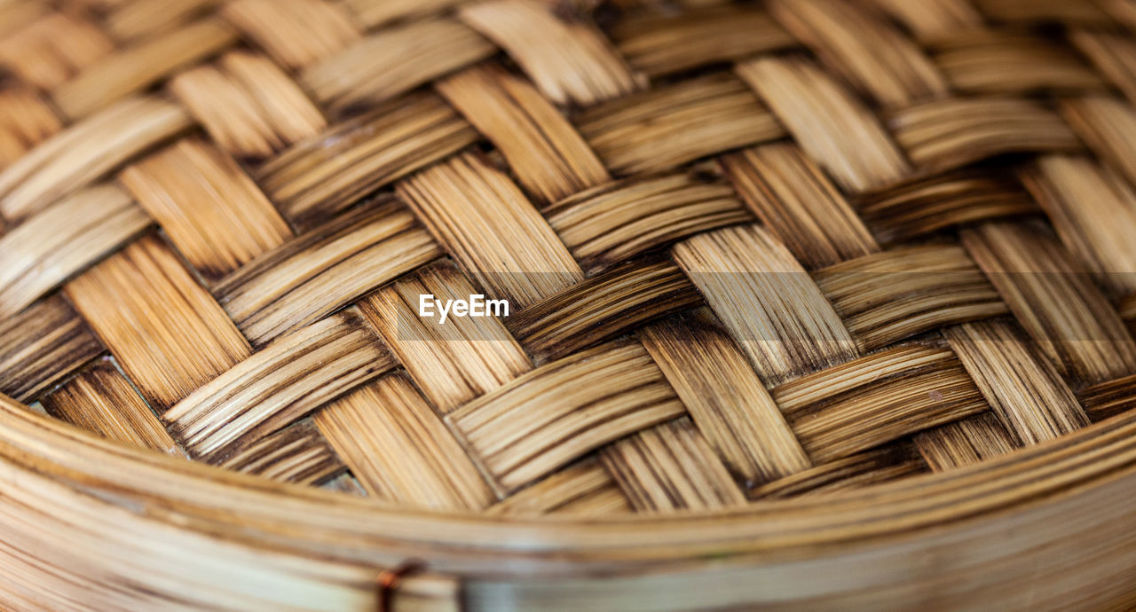 Close-up of a bamboo steamer pot.