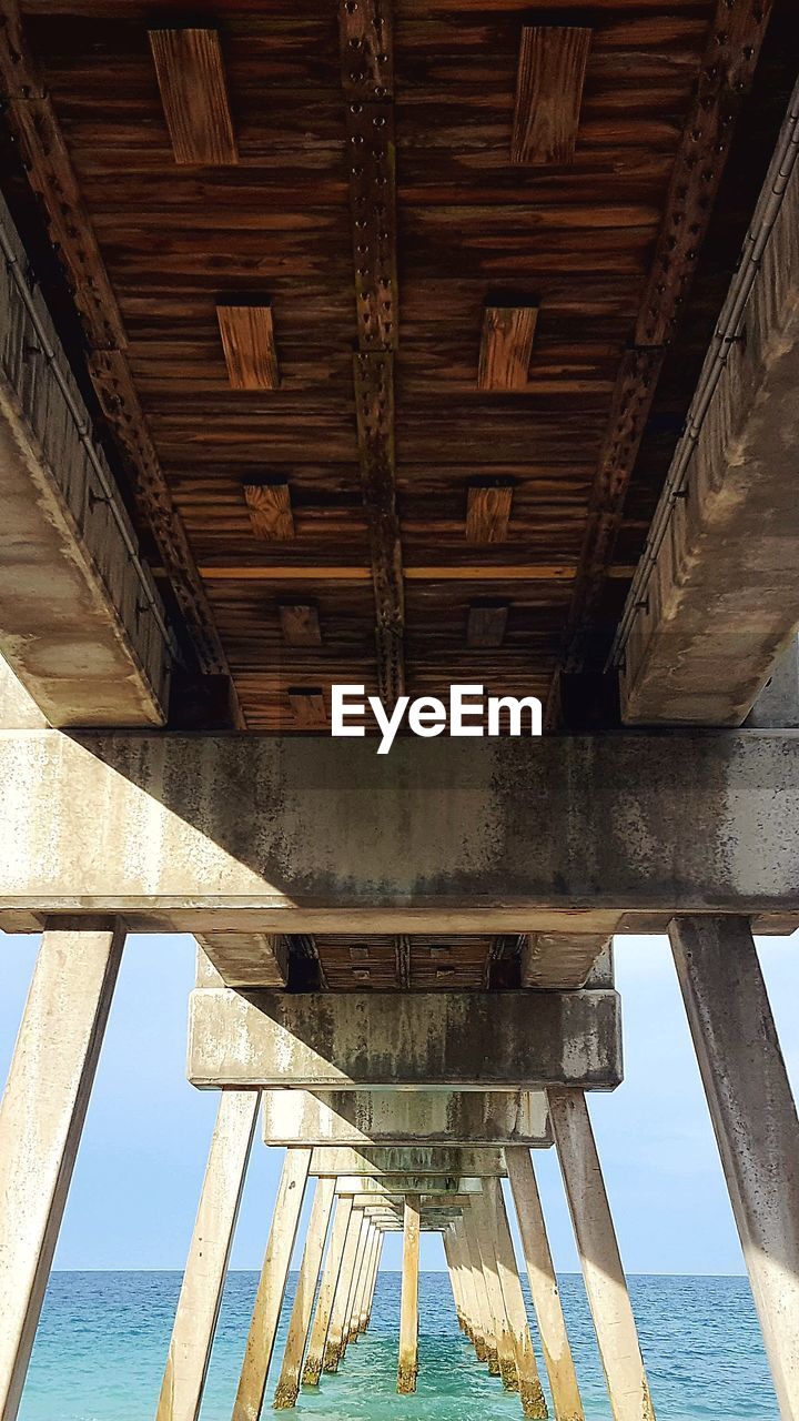 Low angle view of bridge over sea