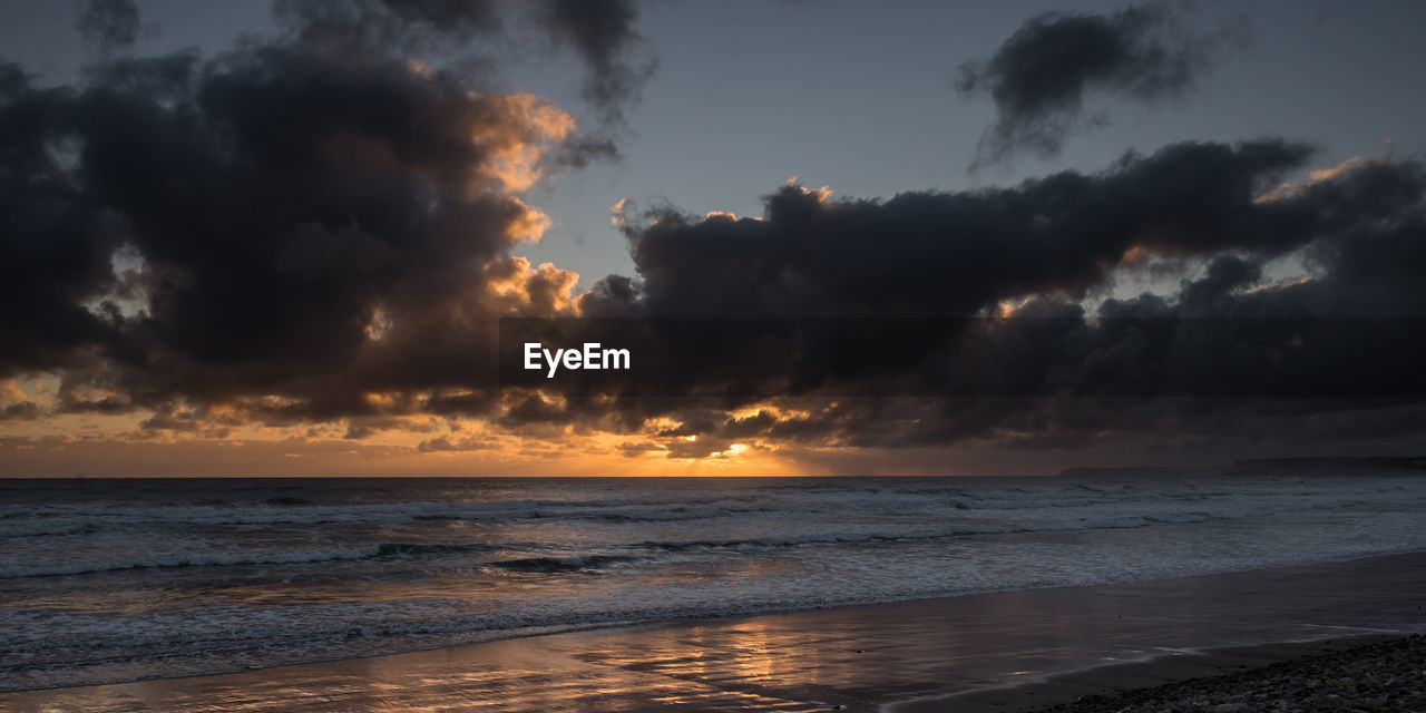 Dramatic sky over calm sea