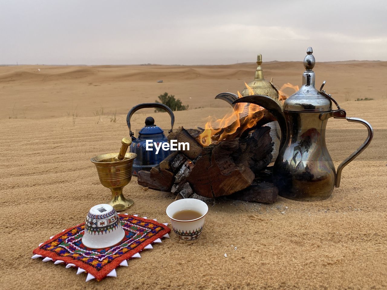 PEOPLE ON TABLE IN DESERT