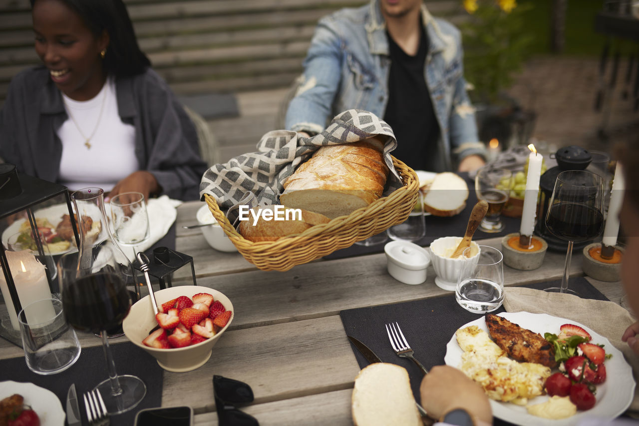 Friends having meal in garden