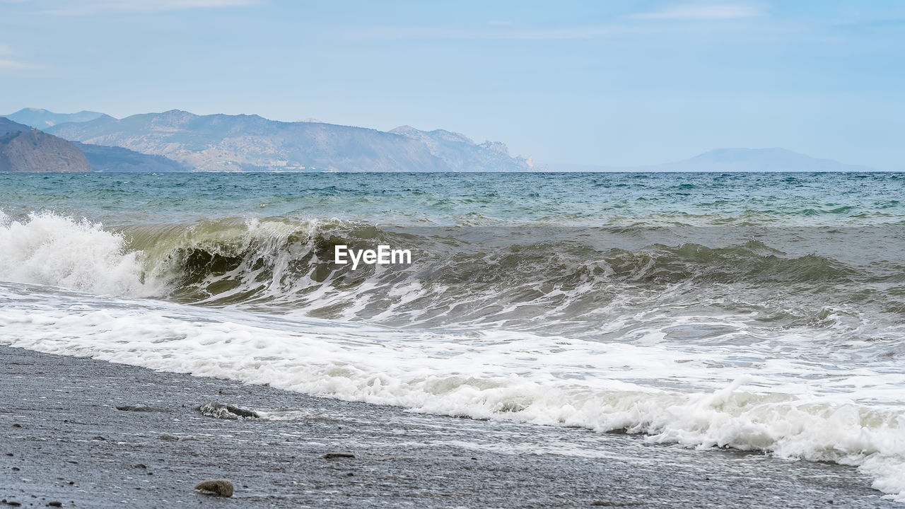 SCENIC VIEW OF SEA WAVES AGAINST SKY