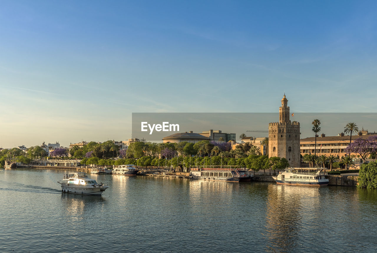 View of the guadalquivir river and the torre del oro, seville, spain