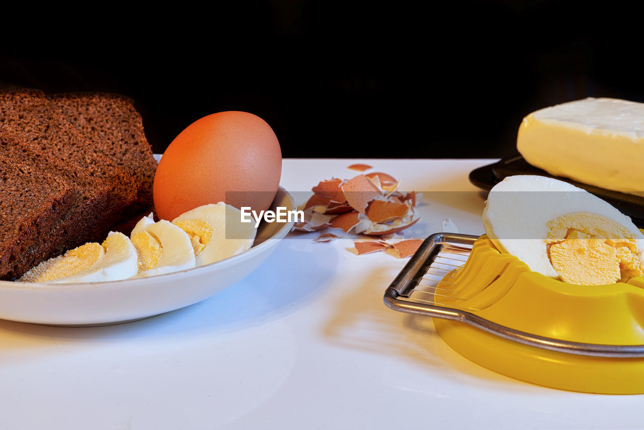 food, food and drink, egg, plate, baked, meal, table, dessert, breakfast, freshness, no people, bread, healthy eating, still life, indoors, sweet food, egg yolk, fast food, wellbeing, dairy, kitchen utensil, eating utensil, sweet, cake