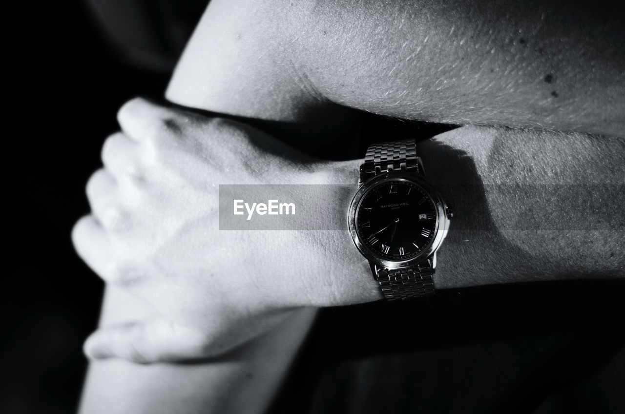 Cropped image of man wearing wrist watch