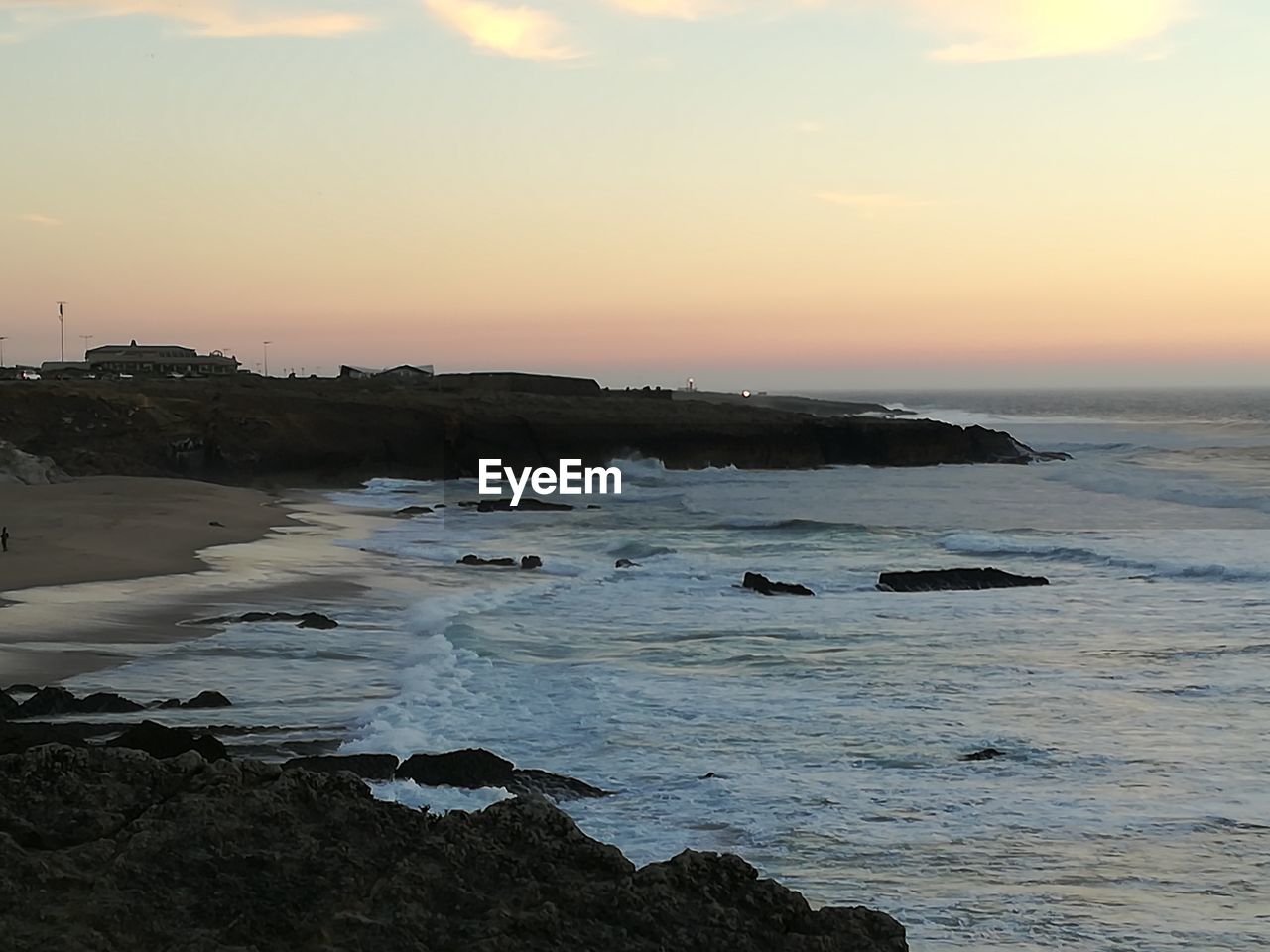 VIEW OF CALM SEA AGAINST SKY DURING SUNSET