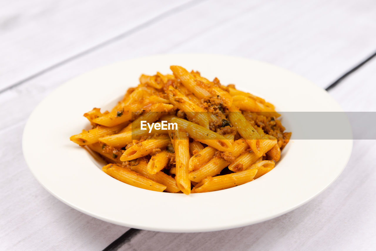 food, food and drink, fast food, french fries, unhealthy eating, raw potato, dish, plate, fried, produce, vegetable, cuisine, freshness, snack, table, no people, meal, condiment, indoors, close-up, wood, fried food, savory food, italian food, still life