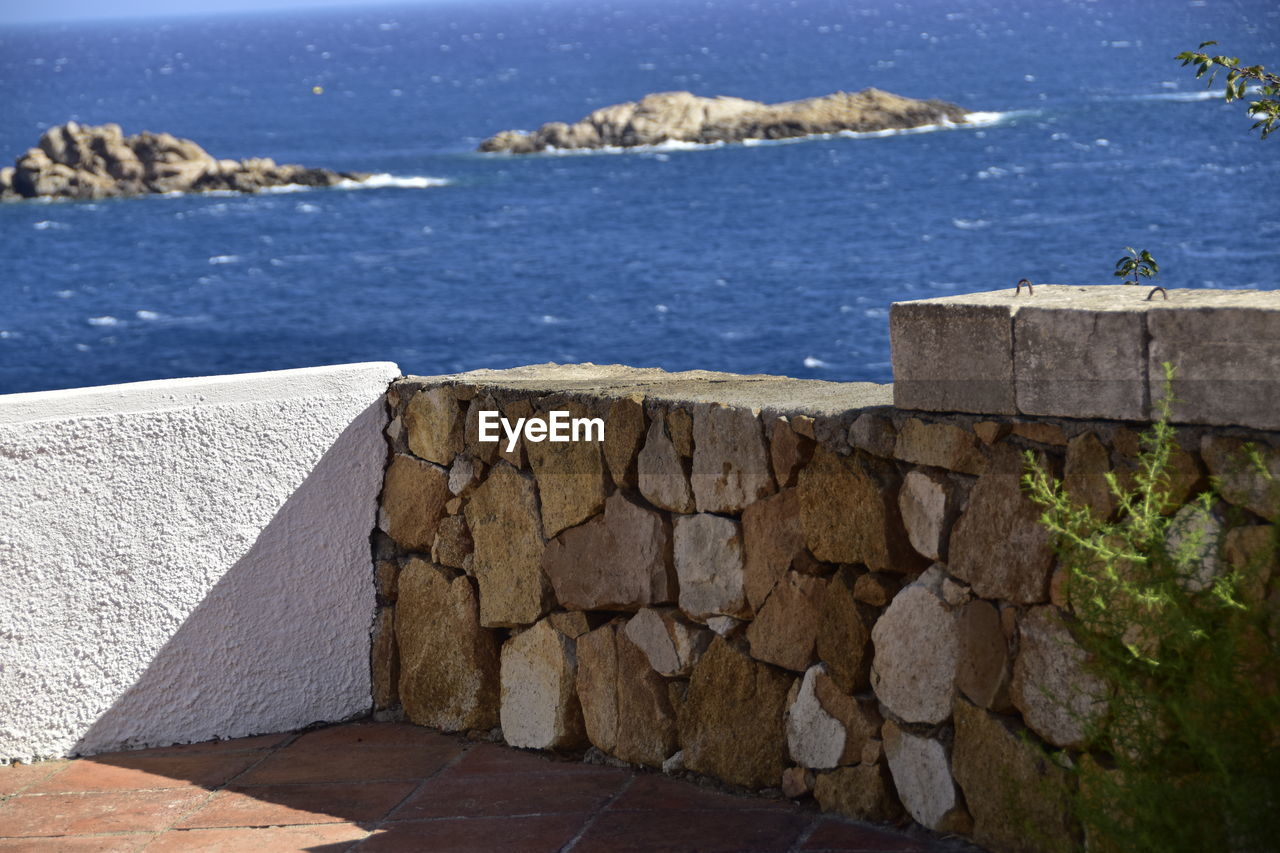 STONE WALL BY SEA